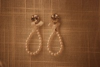 swarovski wit met kleine kraaltjes en strik